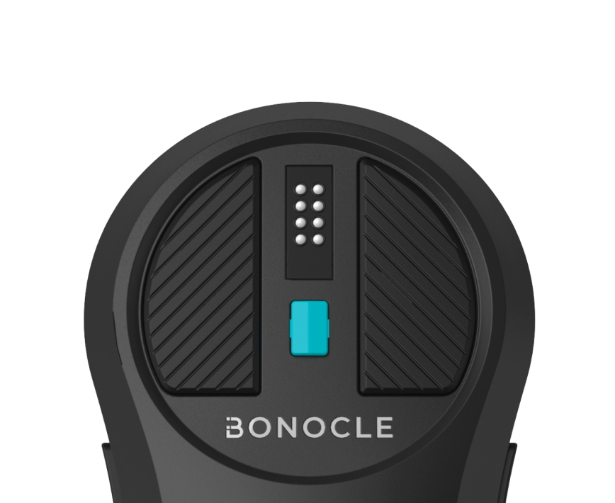 A close up of Bonocle's widest section. This section at the top of the device contains the braille cell surrounded by buttons. Next and previous button on each side and the Middle button below the braille cell. The device and buttons are different shades of black while the middle button is colored in teal. Under the middle button is the Bonocle logo in white.